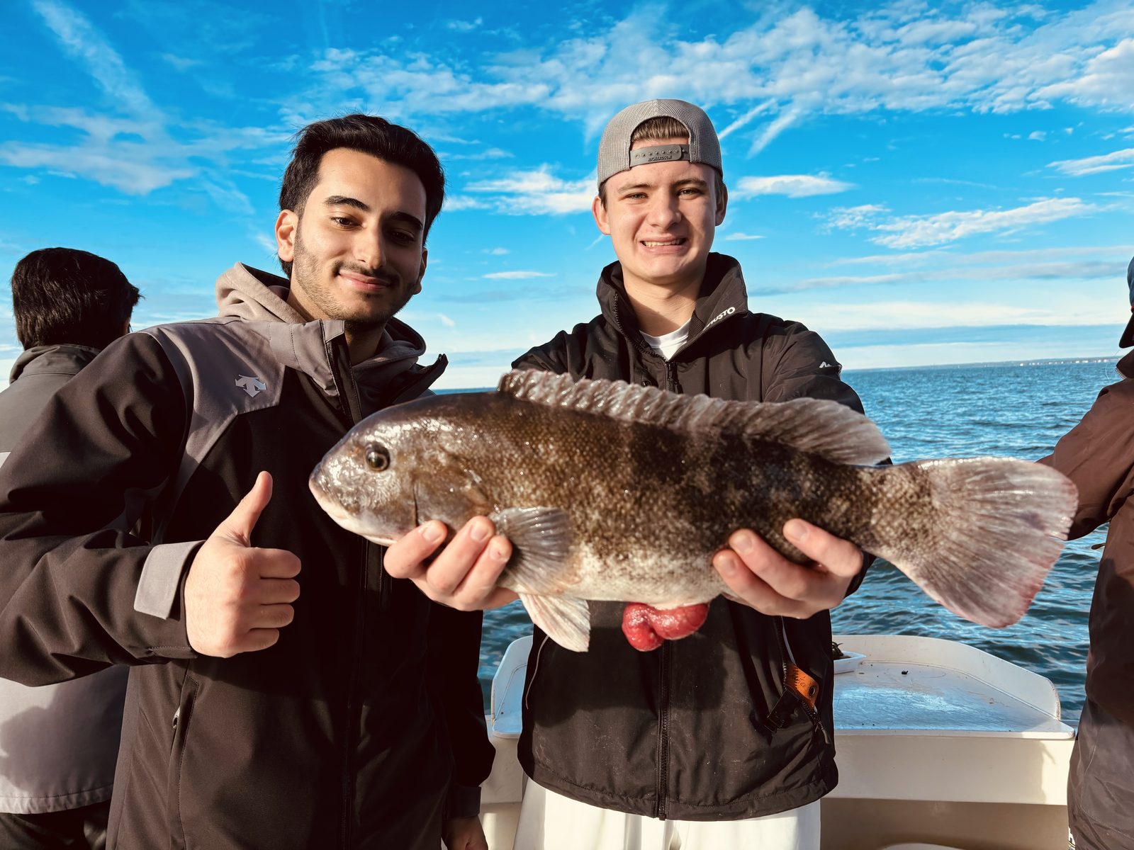 Two anglers with a blackfish
