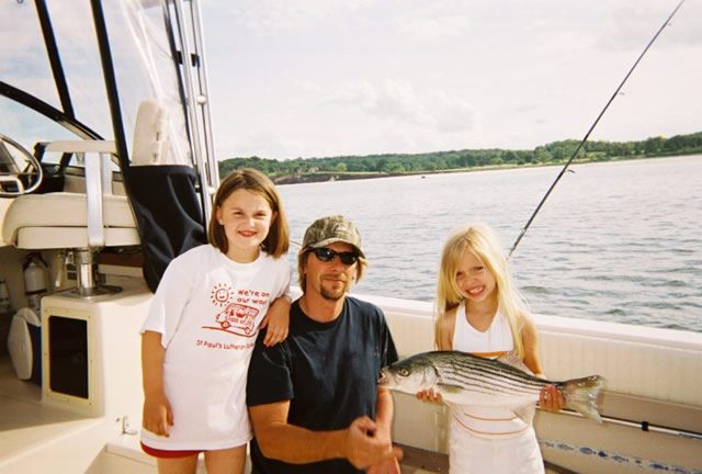 A family charter with a striped bass