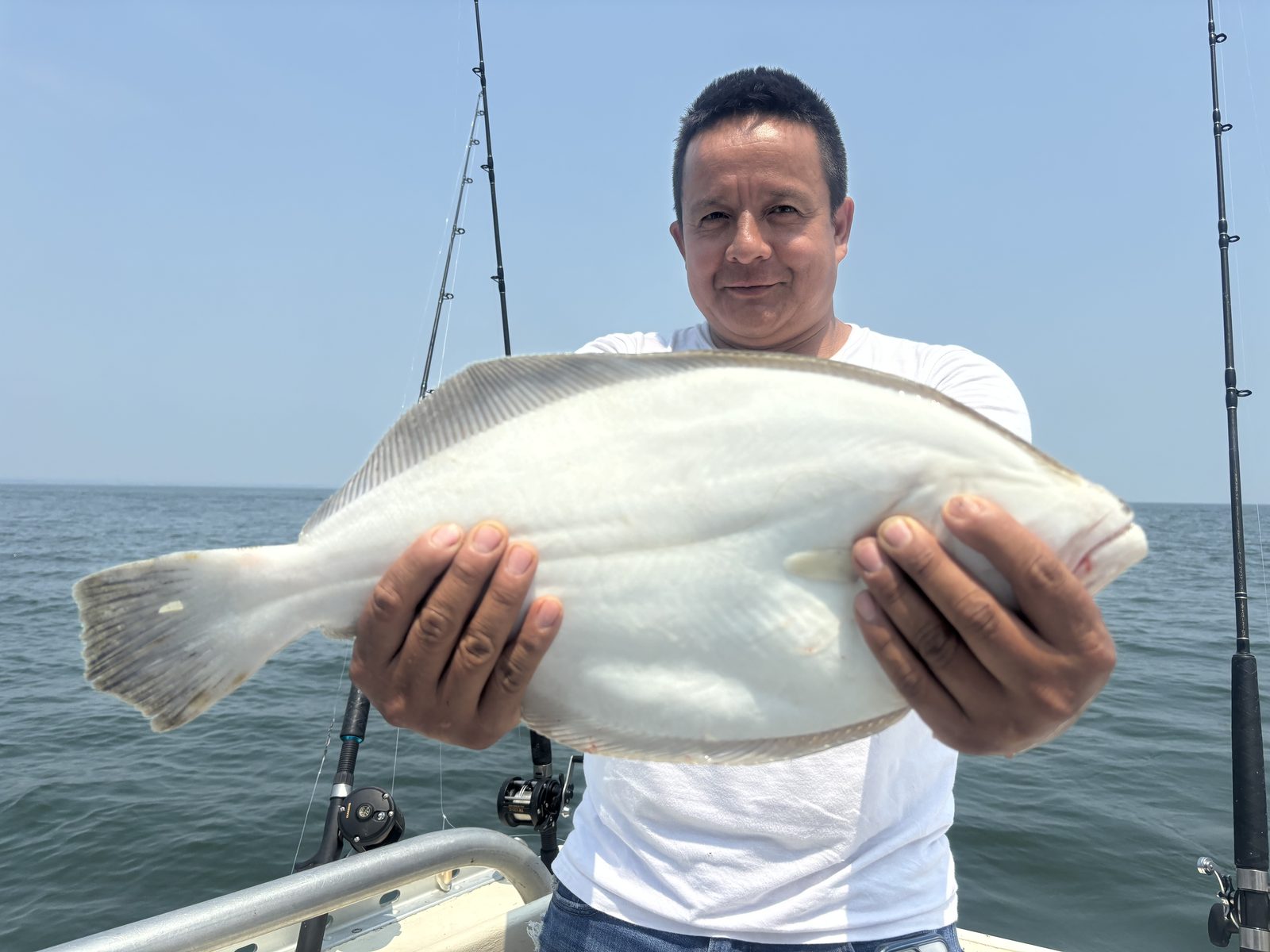 An angler with a big fluke