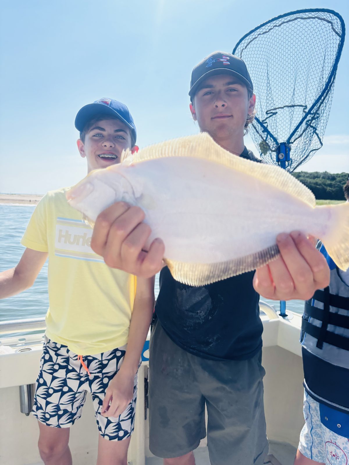 Two young anglers with a fluke