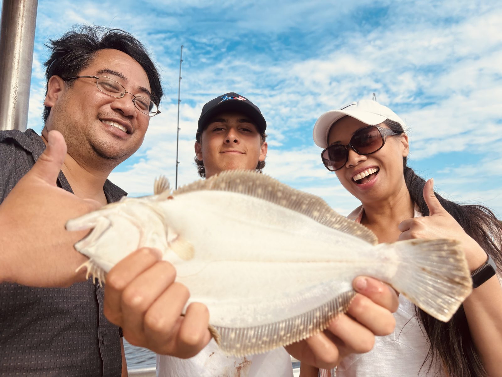 Guests smiling with a fluke