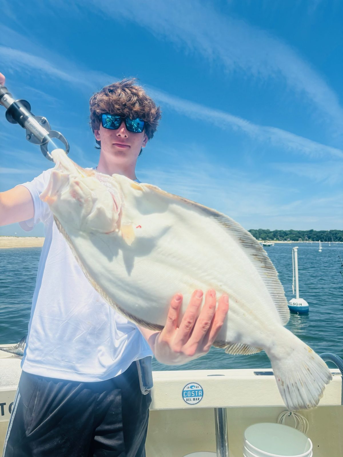 A young angler with a fluke
