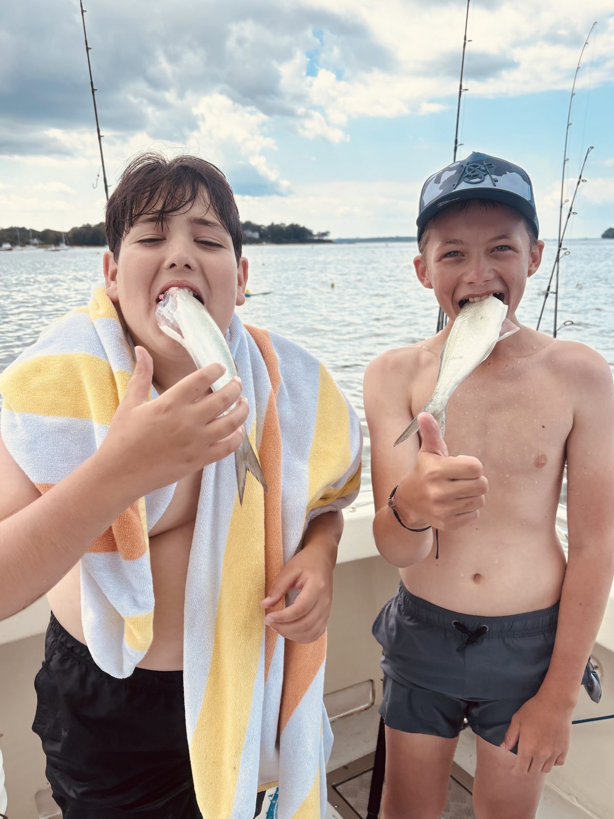 Two kids kissing their catch