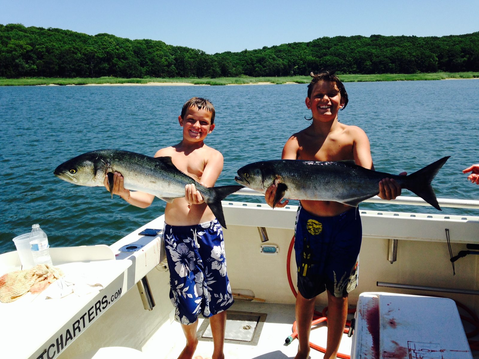 Two campers with a bluefish