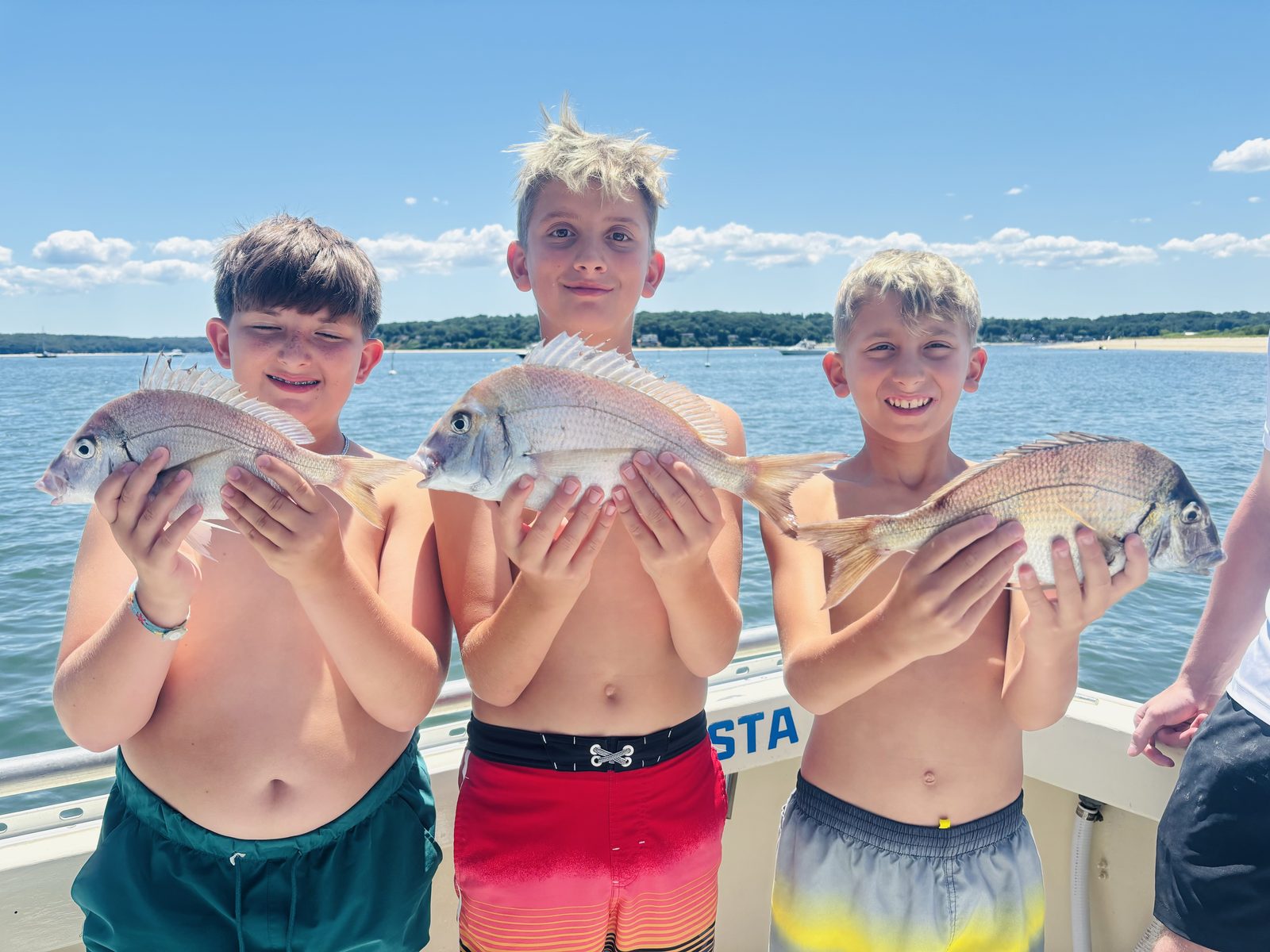 Three kids with porgies