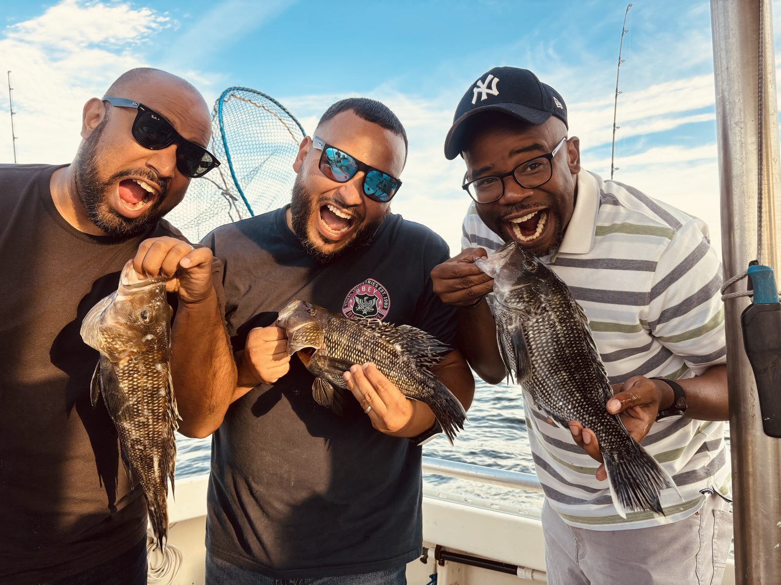 Three anglers with black sea bass